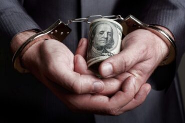 1636973173 depositphotos 5348587 stock photo business man arrested for bribe.jpg